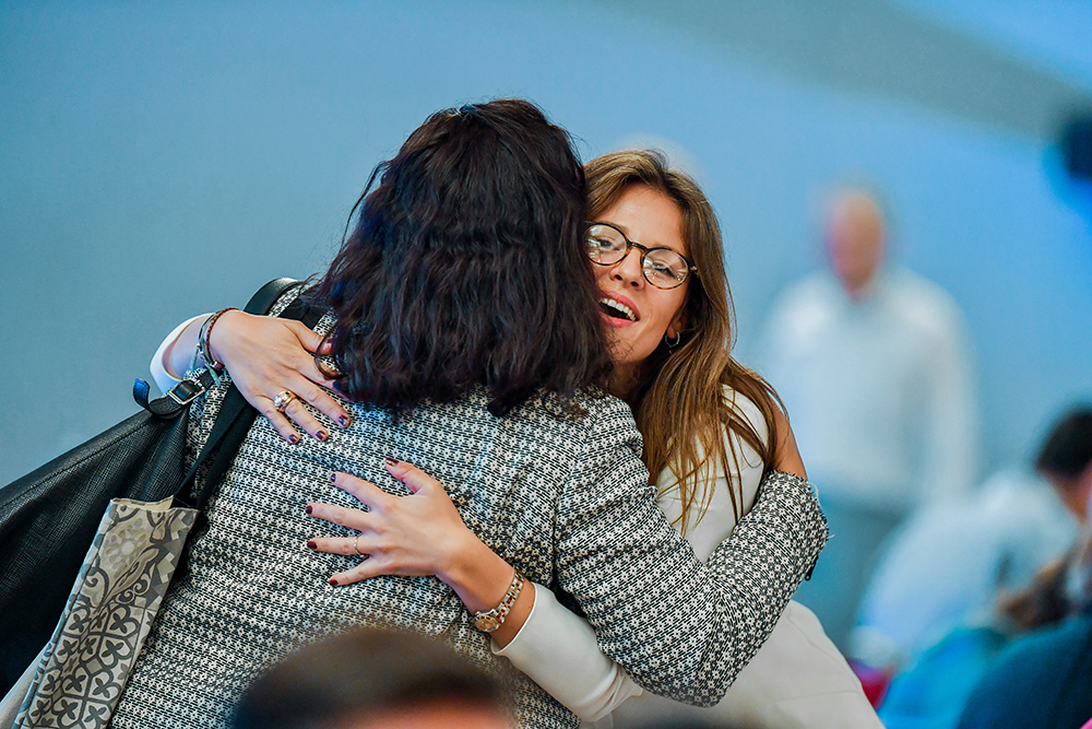 two womens hugging