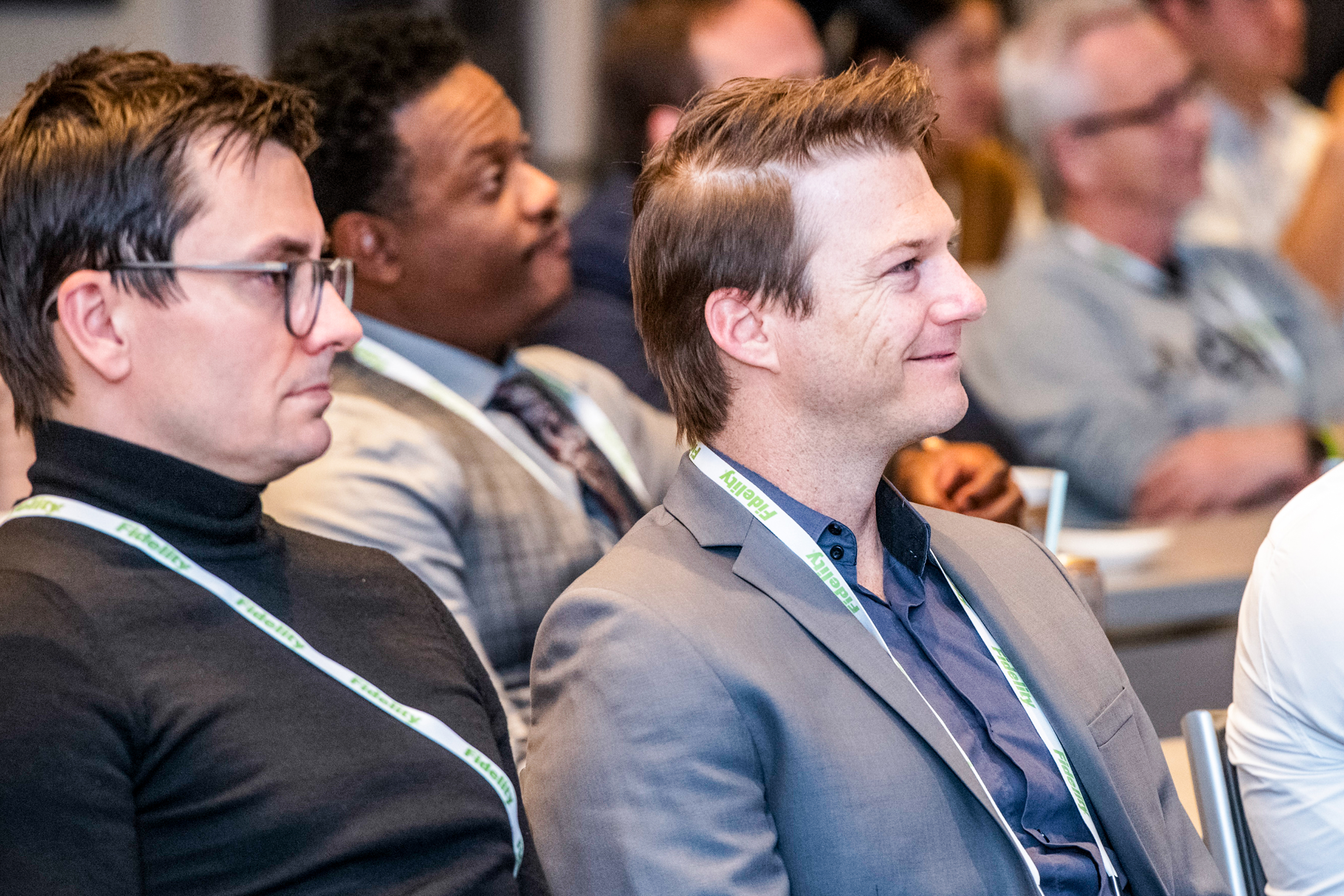 two men watching presentation